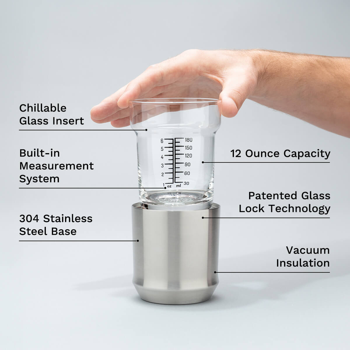 Hand holding the Elevated Craft Hybrid cocktail glass insert above the stainless steel base
