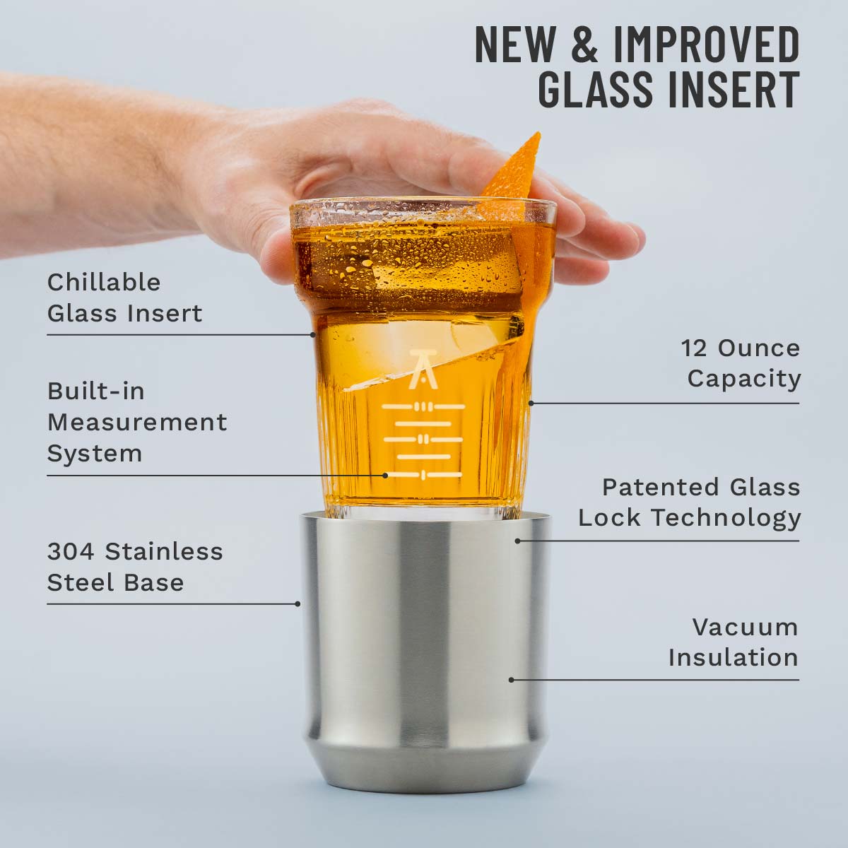 Hand holding the Elevated Craft Hybrid cocktail glass insert above the stainless steel base