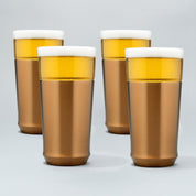 Four Elevated Craft brushed copper hybrid pint glasses filled with cold beer