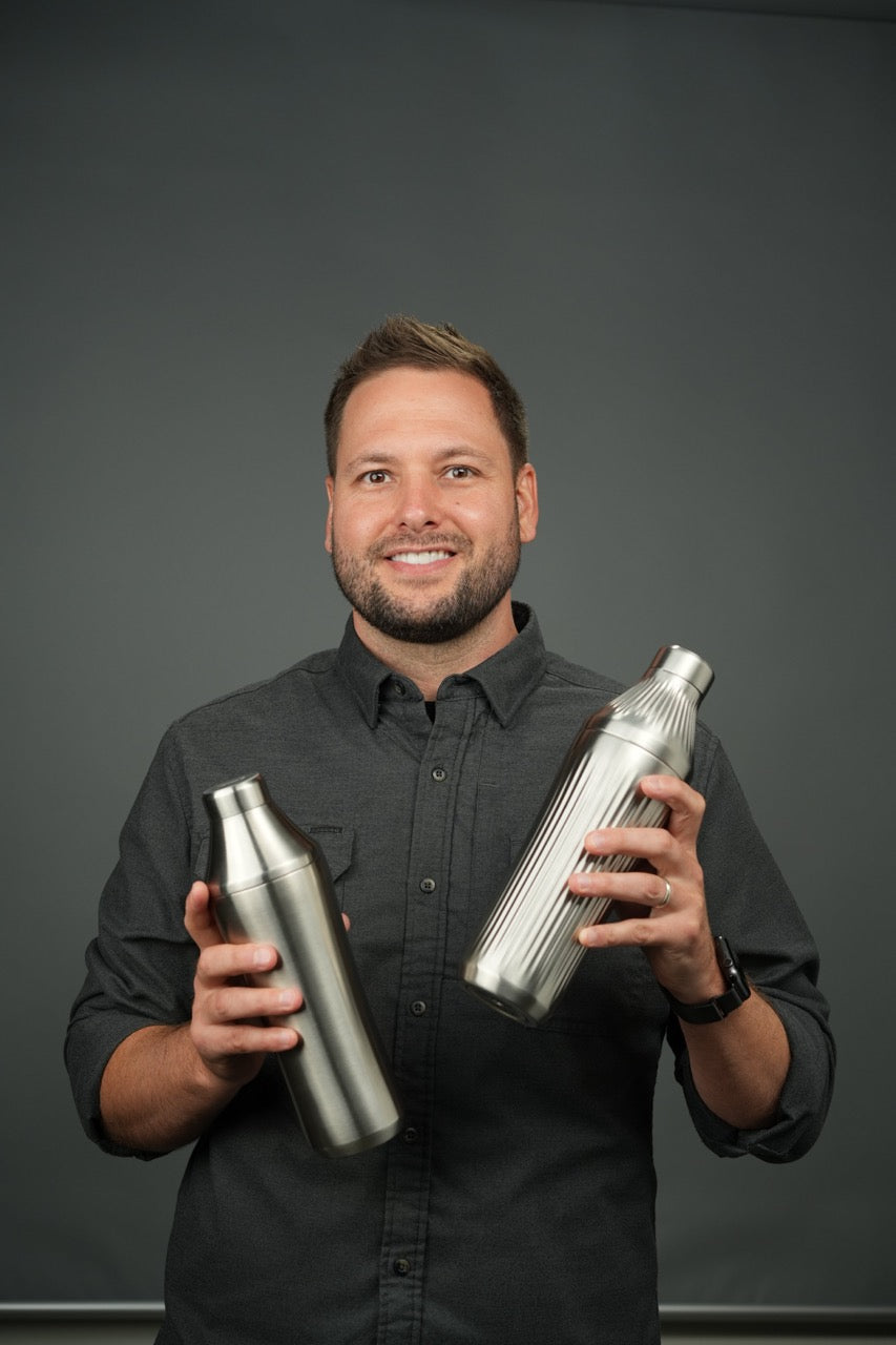 Founder Adam Craft holding the Essential and Diamond Edition Hybrid Cocktail Shakers