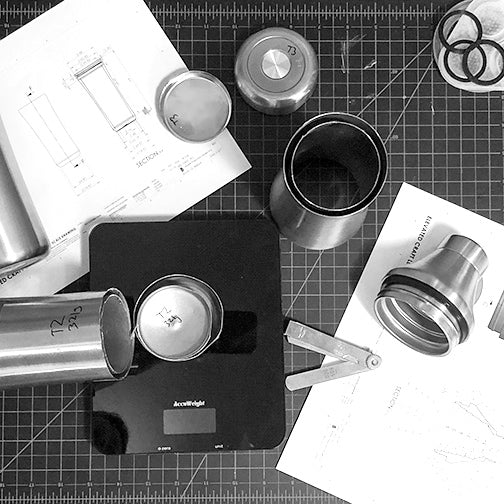 Workshop table overhead view of materials that were used to design and develop the Elevated Craft Hybrid Cocktail Shaker