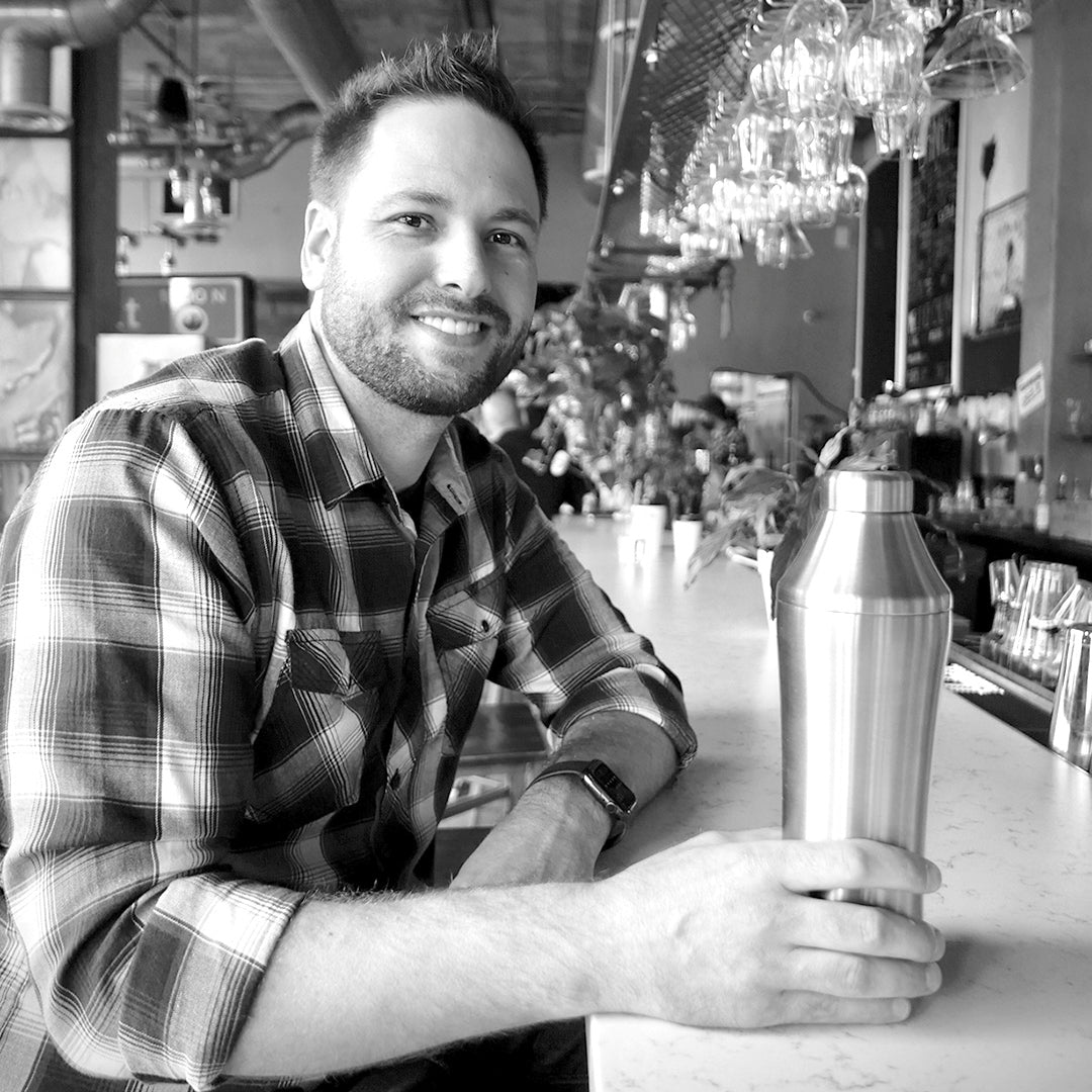 Founder Adam Craft at bar with the Hybrid Cocktail Shaker in hand