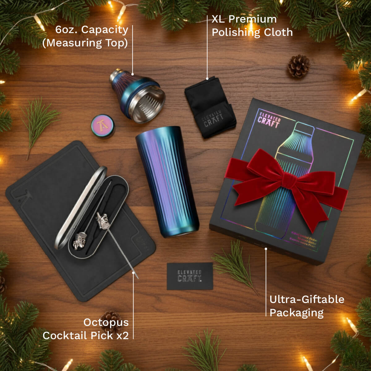 Elevated Craft cocktail kit with tumbler, tools, and packaging on a wooden surface with Christmas decorations.