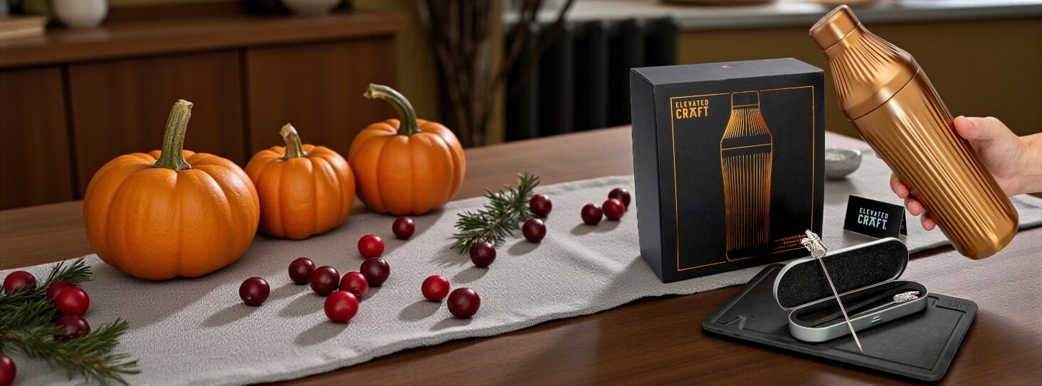 Copper Cocktail Shaker Gift Set next to its box cutting board and cocktail picks on a table with fall decorations