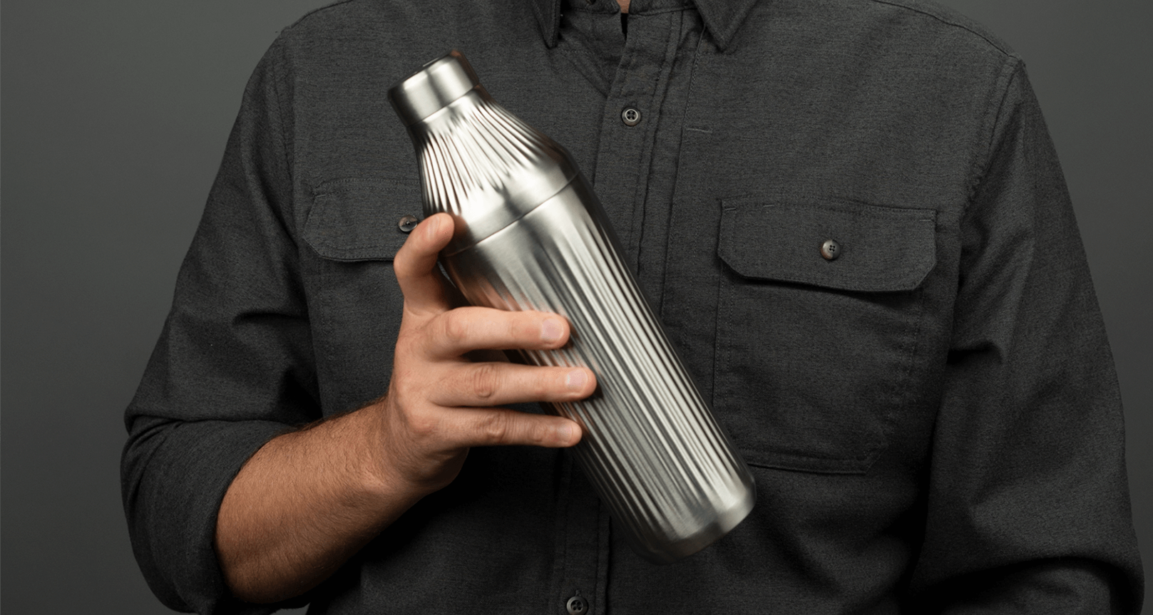 Man holding the Stainless Steel Elevated Craft Diamond Edition Hybrid Cocktail Shaker in front of his chest