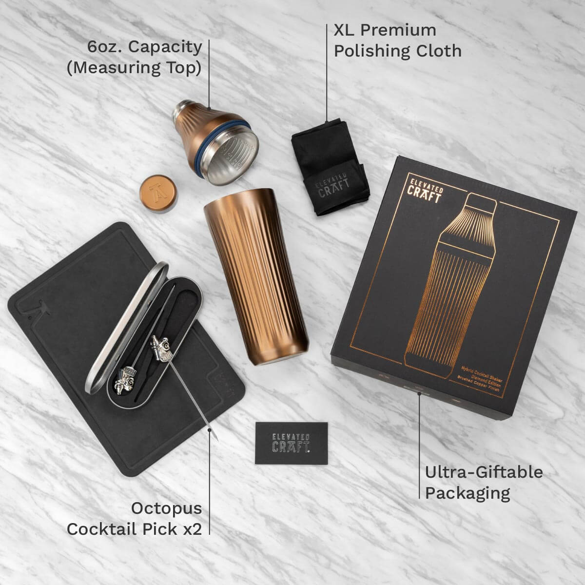 Cocktail shaker set with packaging on a light wooden surface