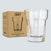Clear cocktail glass with 'Elevated Craft' packaging on a light gray background
