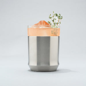 Steel Hybrid Cocktail Glass on grey background with pink cocktail inside