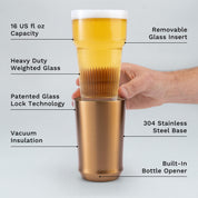Hand holding glass insert of Elevated Craft Brushed Copper Hybrid Pint Glass above the steel base with feature callouts