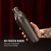 Hand holding Gunmetal Black Elevated Craft Diamond Edition Hybrid Cocktail Shaker with tattoos on arm
