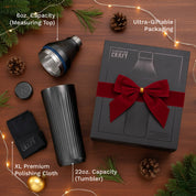 Elevated Craft product set with tumbler, measuring top, polishing cloth, and packaging on a wooden surface with decorative elements.