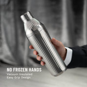 Hand holding Stainless Steel Elevated Craft Diamond Edition Hybrid Cocktail Shaker with suit arm
