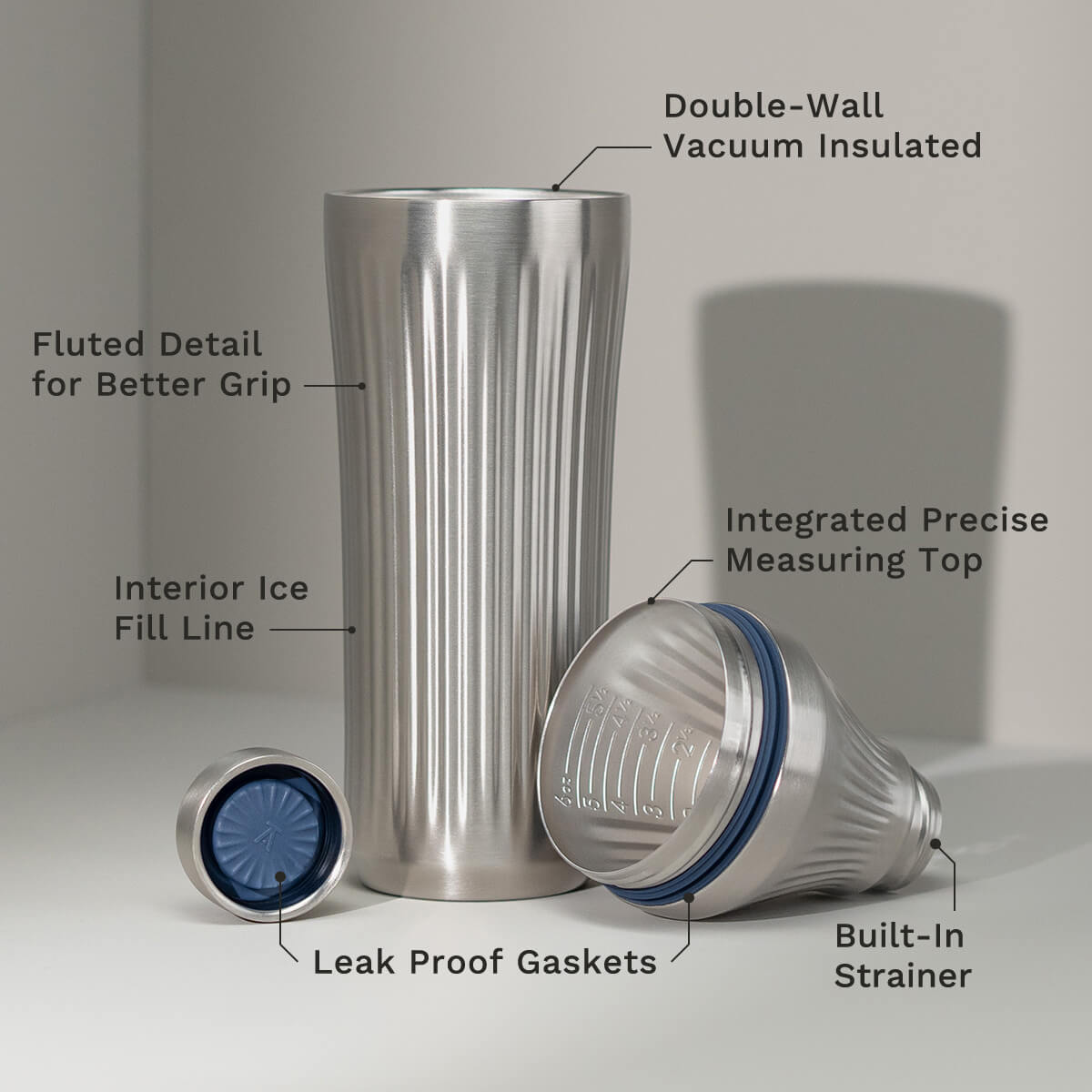 Stainless Steel Elevated Craft Diamond Edition Hybrid Cocktail Shaker split up into parts to showcase tumbler, measuring top and lid