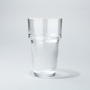 Clear glass tumbler on a light gray background