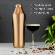 Brushed Copper Elevated Craft Hybrid Cocktail Shaker next to espresso martini cocktail with foam on top