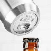 Closeup of the Elevated Craft Hybrid Pint Glass Bottle Opener hidden on the bottom of the steel base which features the brushed stainless finish