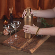 Gif-style video of woman using the Brushed Copper Elevated Craft Diamond Edition Hybrid Cocktail Shaker to make an espresso martini