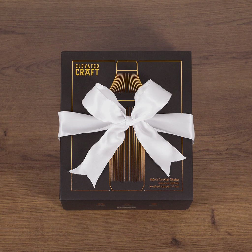 Gif-style video of unboxing Brushed Copper Elevated Craft Diamond Edition Hybrid Cocktail Shaker with white ribbon bow