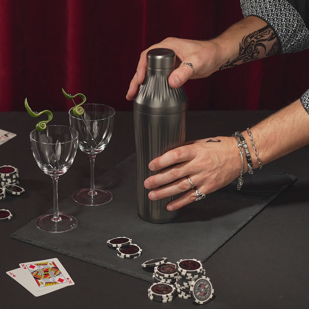 Gif-style video of man with tattoos using the Gunmetal Black Elevated Craft Diamond Edition Hybrid Cocktail Shaker to make a Naked & Famous cocktail