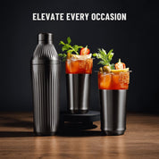 Gif of Gunmetal Elevated Craft Diamond Edition Cocktail Shaker next to two Hybrid Pint Glasses with drinks changing in each frame, dark background. 