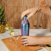 Video of Elevated Craft brushed aurora diamond edition hybrid cocktail shaker making a drink in a tiki beach environment. 